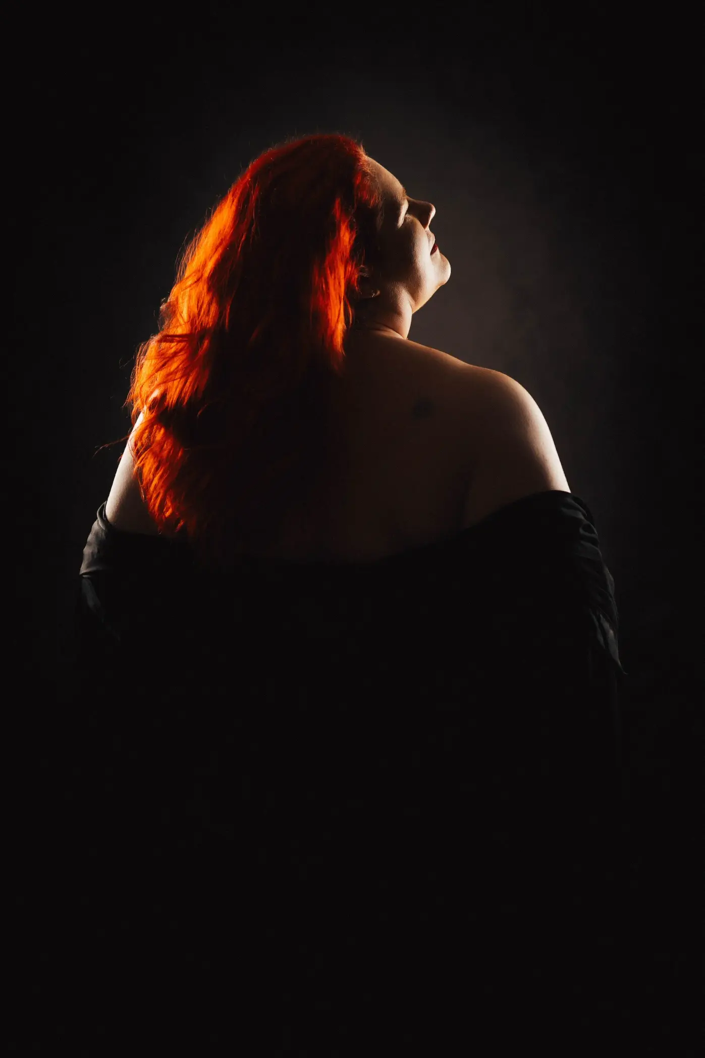 Confident boudoir portrait with soft, natural lighting